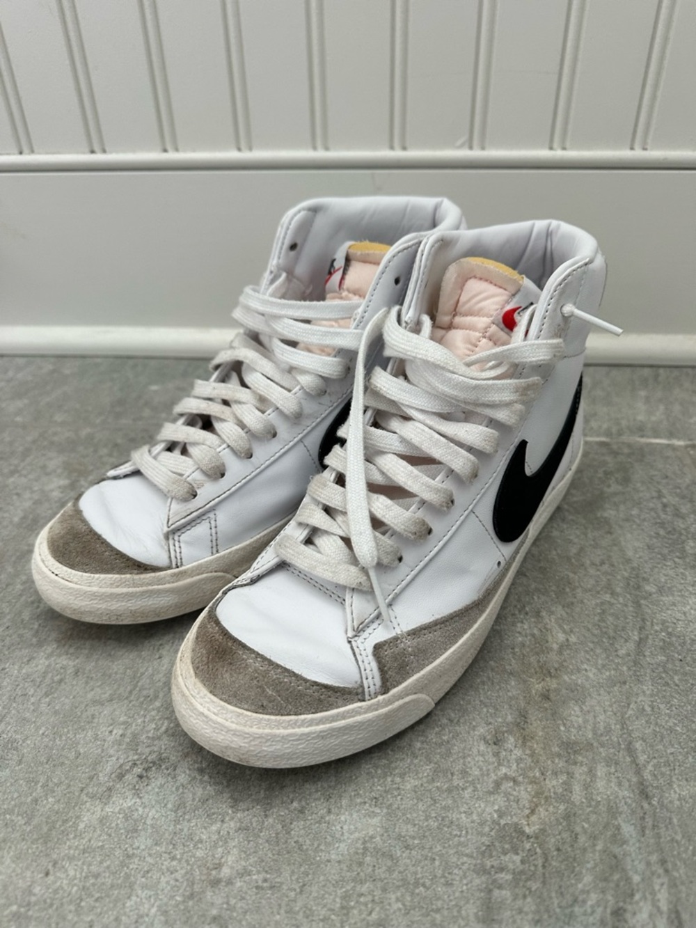 Nike White High-Top Sneakers with Black Swoosh